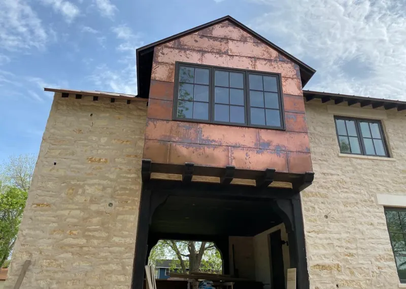 Copper metal panel facade on a stone building for Skylight Installation in Royal Palm Beach